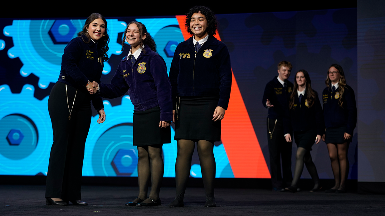 premios FFA members receiving an award on stage at the National FFA Convention.